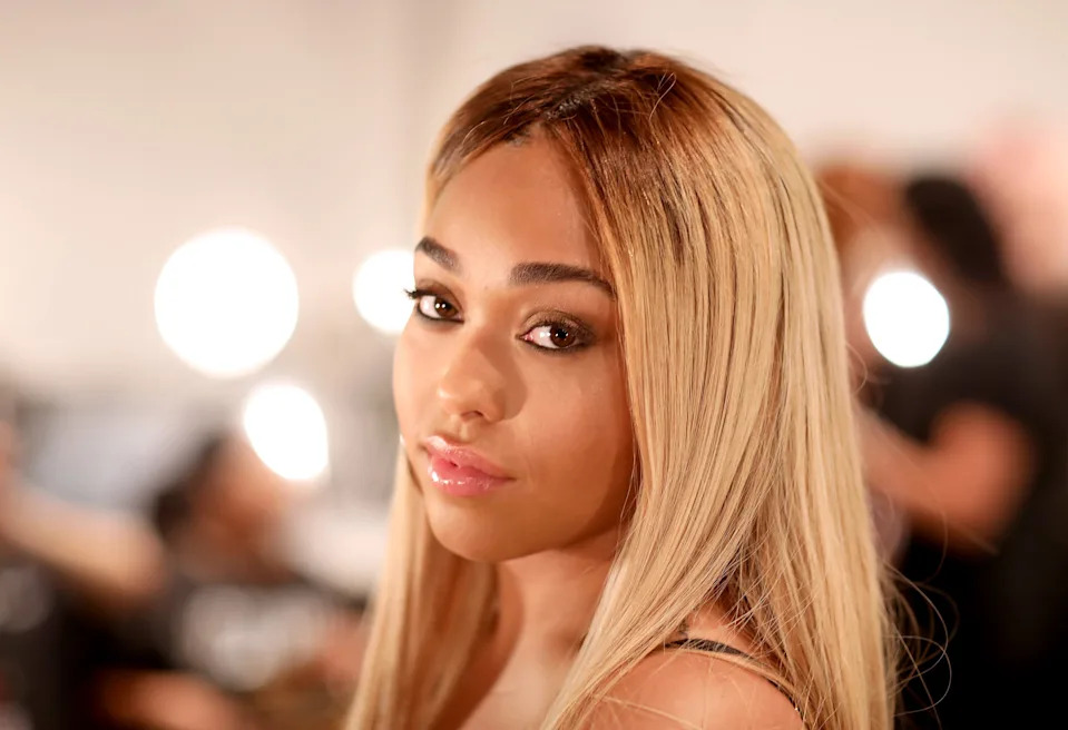 Jordyn Woods prepares backstage.