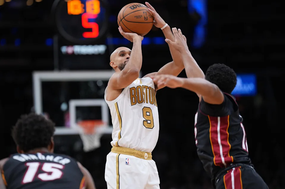 Dec 19, 2025; Boston, Massachusetts, USA; Boston Celtics guard Derrick White (9) shoots the ball against the Miami Heat in the second half at TD Garden. Mandatory Credit: David Butler II-Imagn Images
