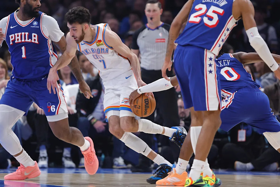 Dec 28, 2025; Oklahoma City, Oklahoma, USA; Philadelphia 76ers guard Tyrese Maxey (0) steals the ball away from Oklahoma City Thunder center Chet Holmgren (7) on a drive during the first quarter at Paycom Center. Mandatory Credit: Alonzo Adams-Imagn Images