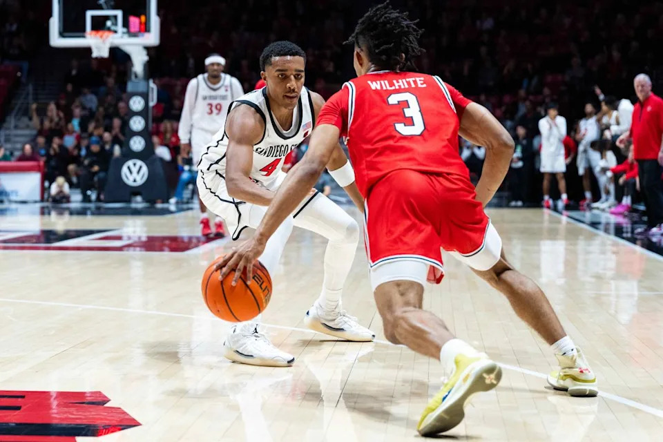 San Diego State guard Sean Newman Jr. (4) guards Lamar guard King-Njhsanni Wilhite (3) during an NCAA Basketball game between Lamar and San Diego State, Wednesday December 10, 2025 at Viejas Arena in San Diego, Calif.