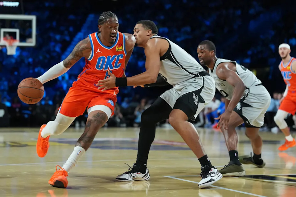 Dec 13, 2025; Las Vegas, Nevada, USA; Oklahoma City Thunder guard Jalen Williams (8) grabs the loose bal in front of San Antonio Spurs forward Keldon Johnson (3) during the first quarter at T-Mobile Arena. Mandatory Credit: Kirby Lee-Imagn Images