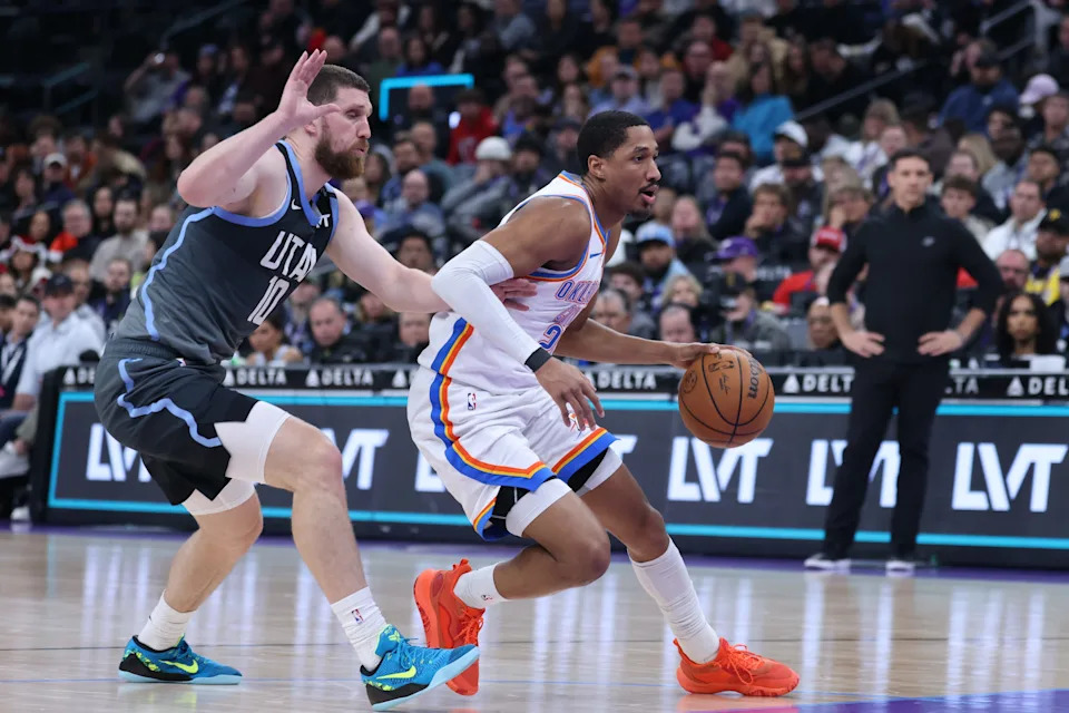 Dec 7, 2025; Salt Lake City, Utah, USA; Oklahoma City Thunder guard Aaron Wiggins (21) goes to the basket against Utah Jazz guard Svi Mykhailiuk (10) during the second quarter at Delta Center. Mandatory Credit: Rob Gray-Imagn Images