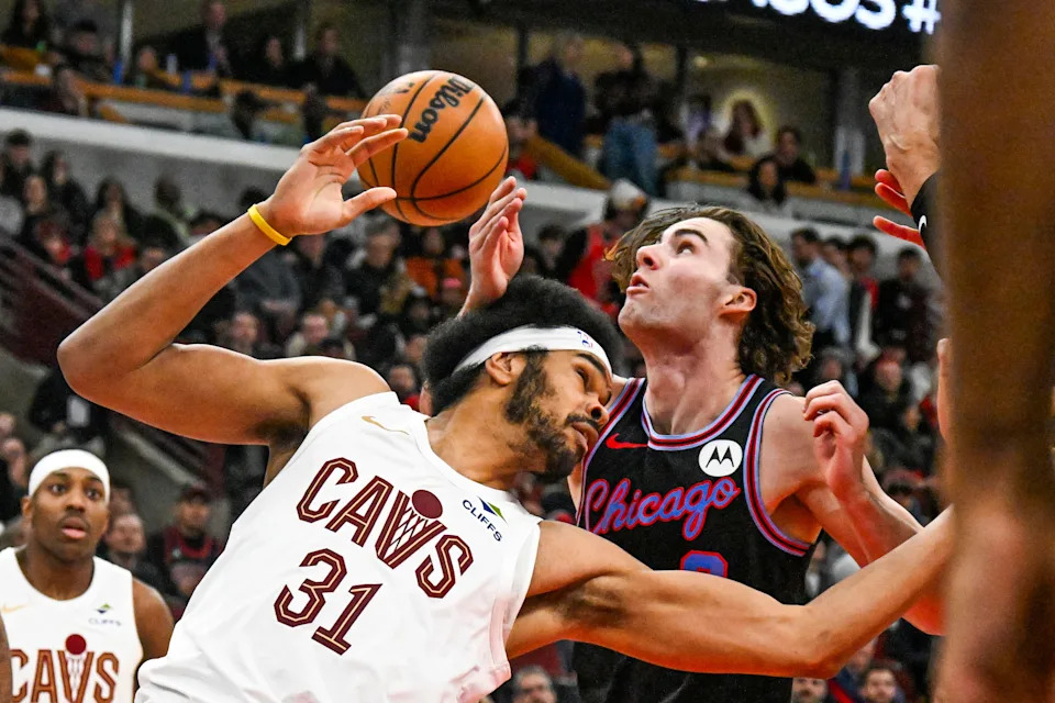 Dec 17, 2025; Chicago, Illinois, USA; Cleveland Cavaliers center Jarrett Allen (31) and Chicago Bulls guard Josh Giddey (3) chase the ball during the second half at United Center. Mandatory Credit: Matt Marton-Imagn Images