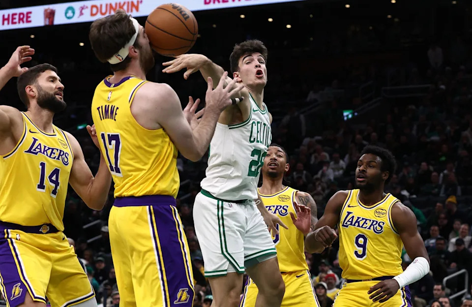 Dec 5, 2025; Boston, Massachusetts, USA; Boston Celtics guard Hugo Gonzalez (28) bats a loose ball into the face of Los Angeles Lakers forward Andrew Timme (17) during the second half at TD Garden. Mandatory Credit: Winslow Townson-Imagn Images