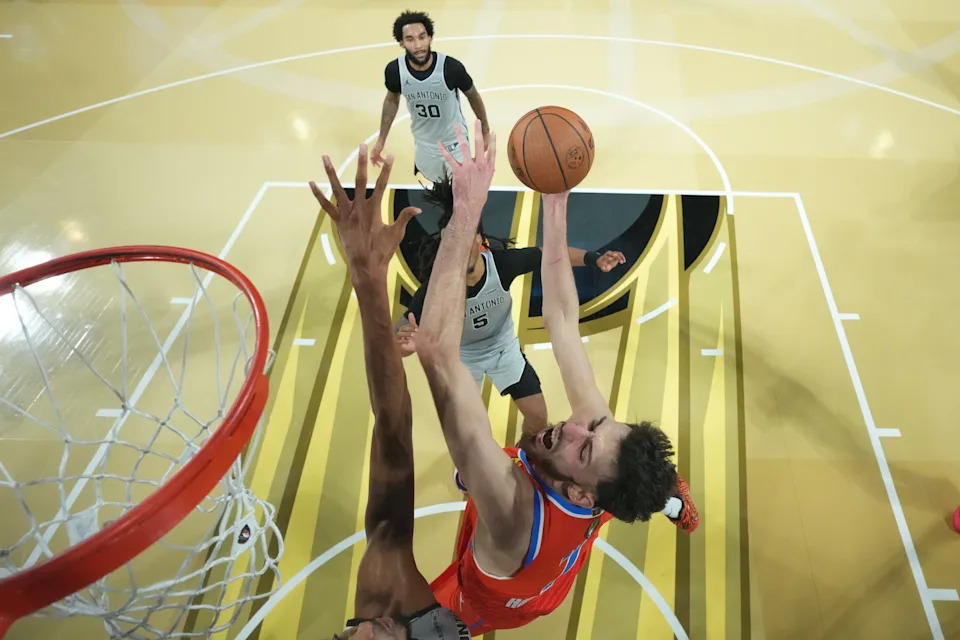 Dec 13, 2025; Las Vegas, Nevada, USA; Oklahoma City Thunder center Chet Holmgren (7) attempt to get his shot off against the San Antonio Spurs during the second half at T-Mobile Arena. Mandatory Credit: Kirby Lee-Imagn Images