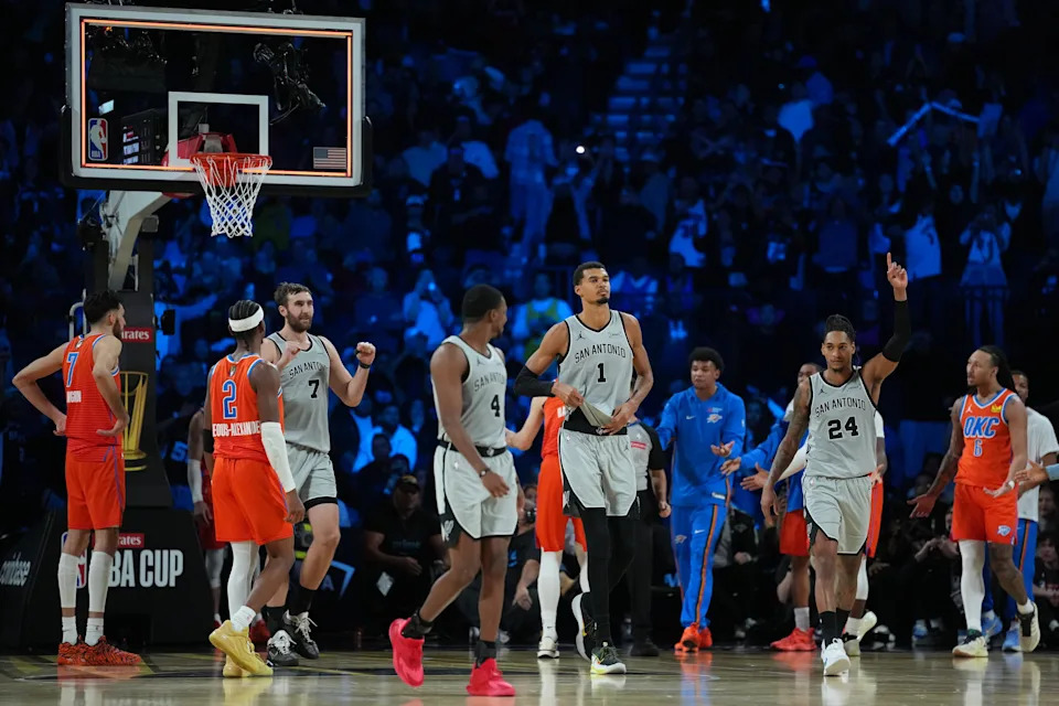 Dec 13, 2025; Las Vegas, Nevada, USA; San Antonio Spurs forward Victor Wembanyama (1), guard Devin Vassell (24) and ]center Luke Kornet (7) react as the final buzzer sounds during a game against the Oklahoma City Thunder at T-Mobile Arena. Mandatory Credit: Kirby Lee-Imagn Images
