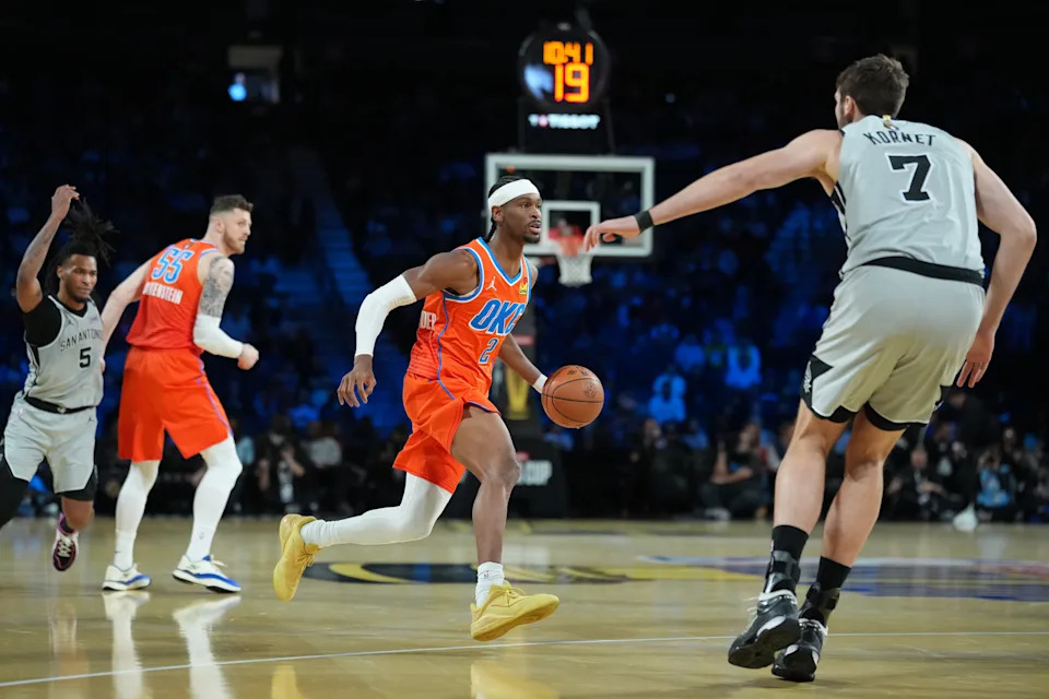 Dec 13, 2025; Las Vegas, Nevada, USA; Oklahoma City Thunder guard Shai Gilgeous-Alexander (2) brings the ball up court against the San Antonio Spurs during the first quarter at T-Mobile Arena. Mandatory Credit: Kirby Lee-Imagn Images