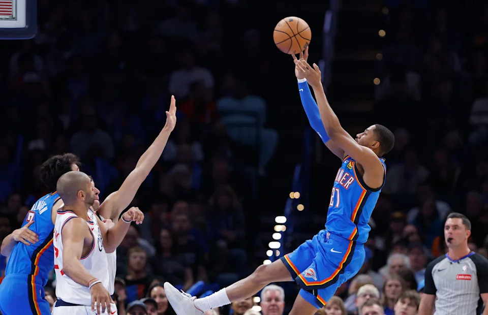 Dec 18, 2025; Oklahoma City, Oklahoma, USA; Oklahoma City Thunder guard Aaron Wiggins (21) shoots against the Los Angeles Clippers during the second half at Paycom Center. Mandatory Credit: Alonzo Adams-Imagn Images