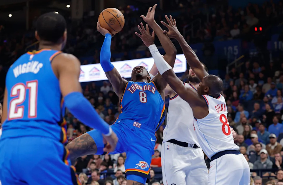 Dec 18, 2025; Oklahoma City, Oklahoma, USA; Oklahoma City Thunder guard Jalen Williams (8) shoots as Los Angeles Clippers guard Kris Dunn (8) defends during the second quarter at Paycom Center. Mandatory Credit: Alonzo Adams-Imagn Images