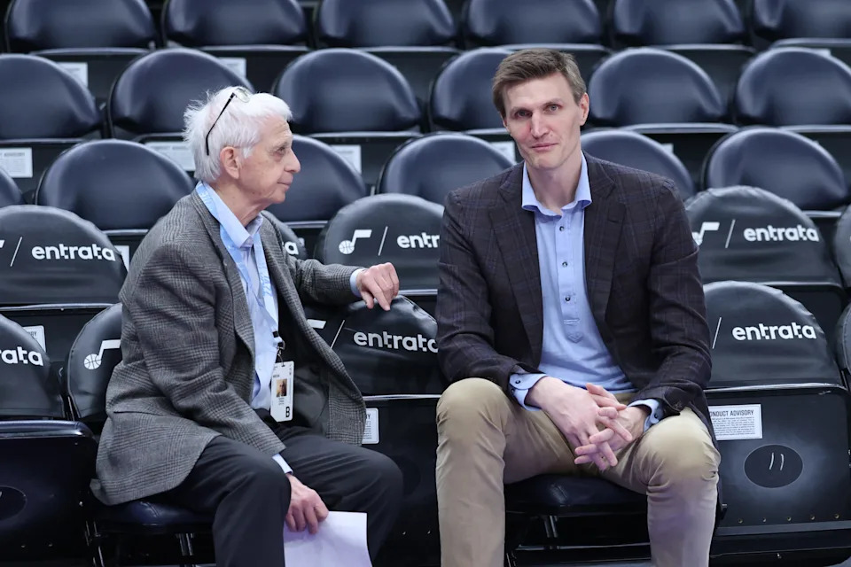 Dec 7, 2025; Salt Lake City, Utah, USA; Former Utah Jazz player Andrei Kirilenko (right) speaks with reporter Gordie Chiesa (left) before the game between the Utah Jazz and the Oklahoma City Thunder at Delta Center. Mandatory Credit: Rob Gray-Imagn Images