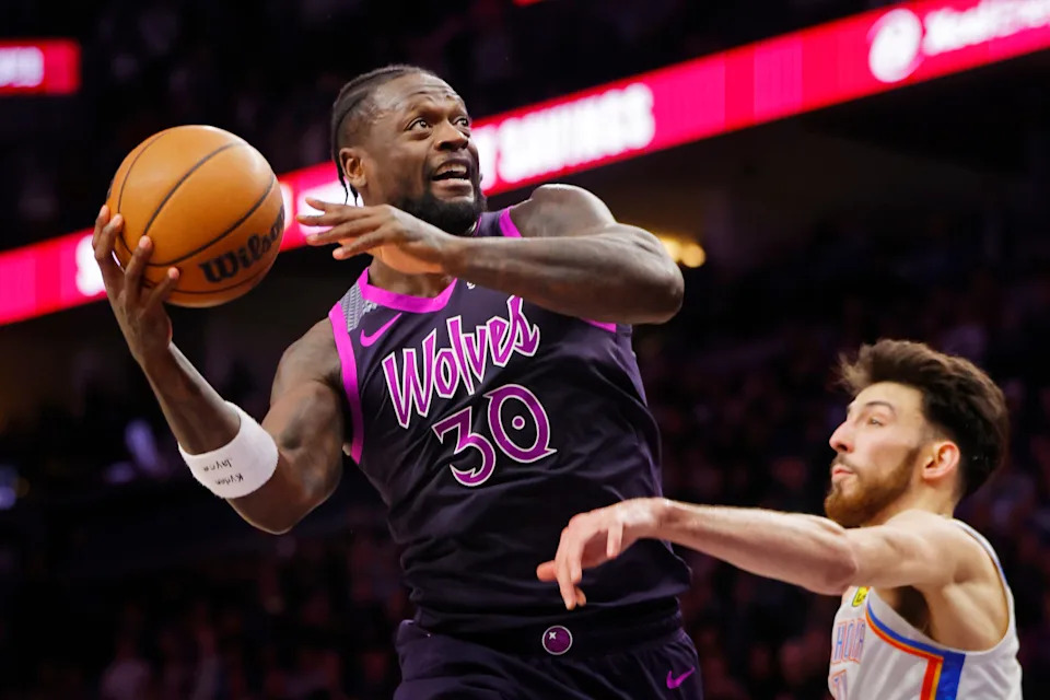 Dec 19, 2025; Minneapolis, Minnesota, USA; Minnesota Timberwolves forward Julius Randle (30) goes to the basket past Oklahoma City Thunder center Chet Holmgren (7) in the fourth quarter at Target Center. Mandatory Credit: Bruce Kluckhohn-Imagn Images