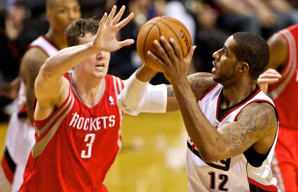 Apr 25, 2014; Portland, OR, USA; Portland Trail Blazers forward LaMarcus Aldridge (12) shoots over Houston Rockets center Omer Asik (3) in game three of the first round of the 2014 NBA Playoffs at the Moda Center. Mandatory Credit: Craig Mitchelldyer-USA TODAY Sports