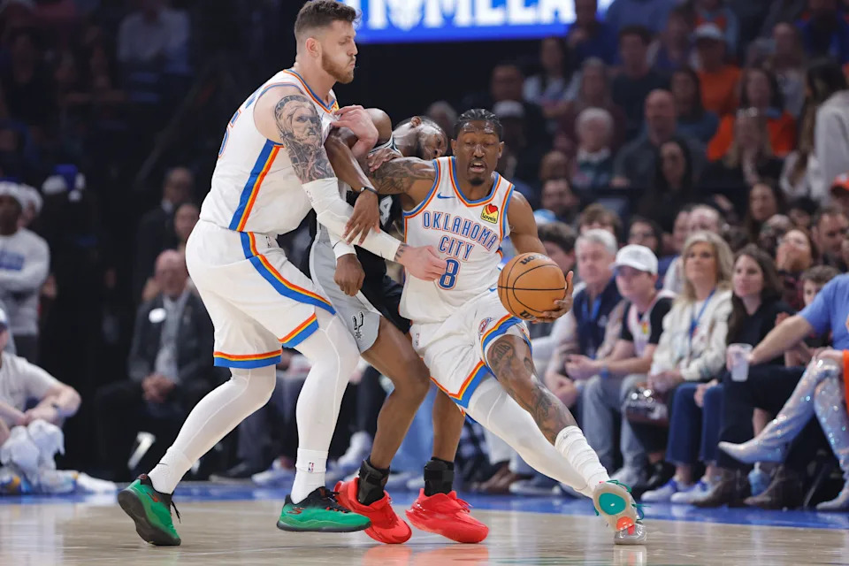 Dec 25, 2025; Oklahoma City, Oklahoma, USA; Oklahoma City Thunder guard Jalen Williams (8) moves the ball around San Antonio Spurs guard De'Aaron Fox (4) during the first quarter at Paycom Center. Mandatory Credit: Alonzo Adams-Imagn Images