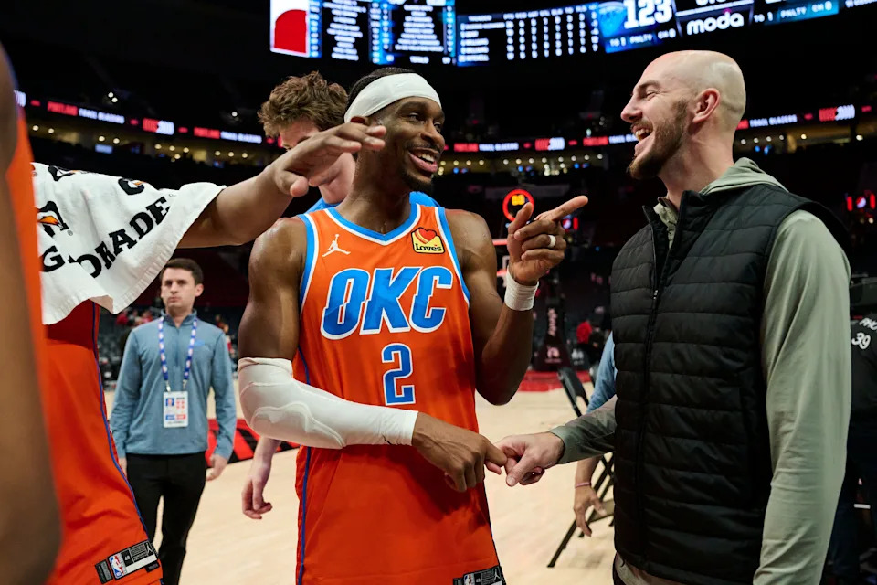 Nov 30, 2025; Portland, Oregon, USA; Oklahoma City Thunder guard Shai Gilgeous-Alexander (2) laughs with guard Alex Caruso (9) after a game against the Portland Trail Blazers at Moda Center. Mandatory Credit: Troy Wayrynen-Imagn Images