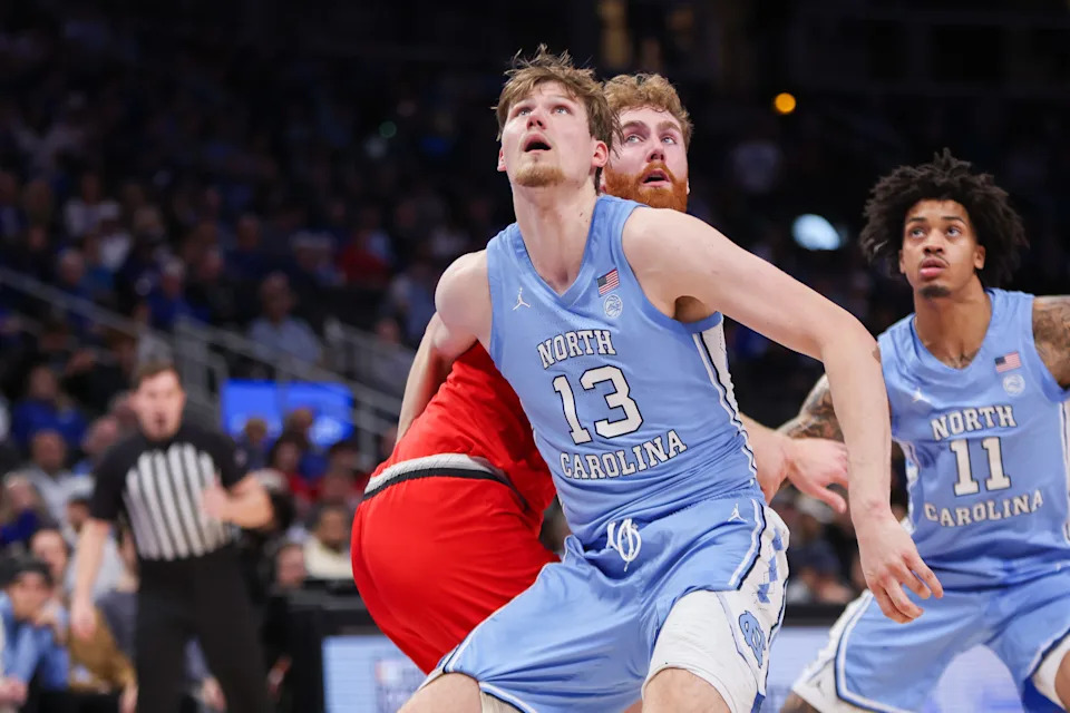 Dec 20, 2025; Atlanta, Georgia, USA; North Carolina Tar Heels center Henri Veesaar (13) boxes out Ohio State Buckeyes forward Brandon Noel (14) in the first half at State Farm Arena. Mandatory Credit: Brett Davis-Imagn Images
