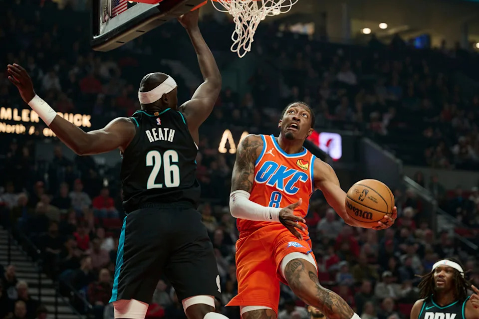 Nov 30, 2025; Portland, Oregon, USA; Oklahoma City Thunder guard Jalen Williams (8) drives to the basket during the first half against Portland Trail Blazers center Duop Reath (26) at Moda Center. Mandatory Credit: Troy Wayrynen-Imagn Images