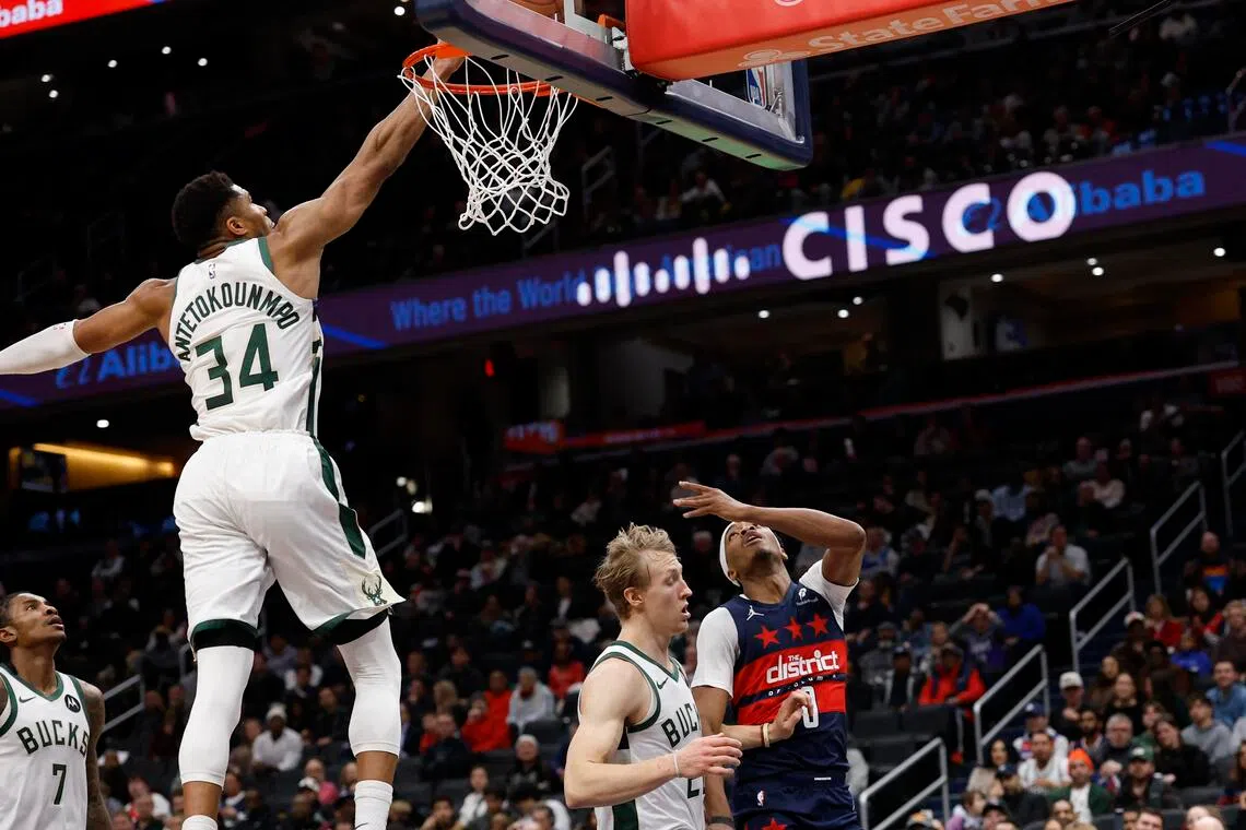 Milwaukee Bucks forward Giannis Antetokounmpo blocks the shot of Washington Wizards guard Bilal Coulibaly in the second half at Capital One Arena.