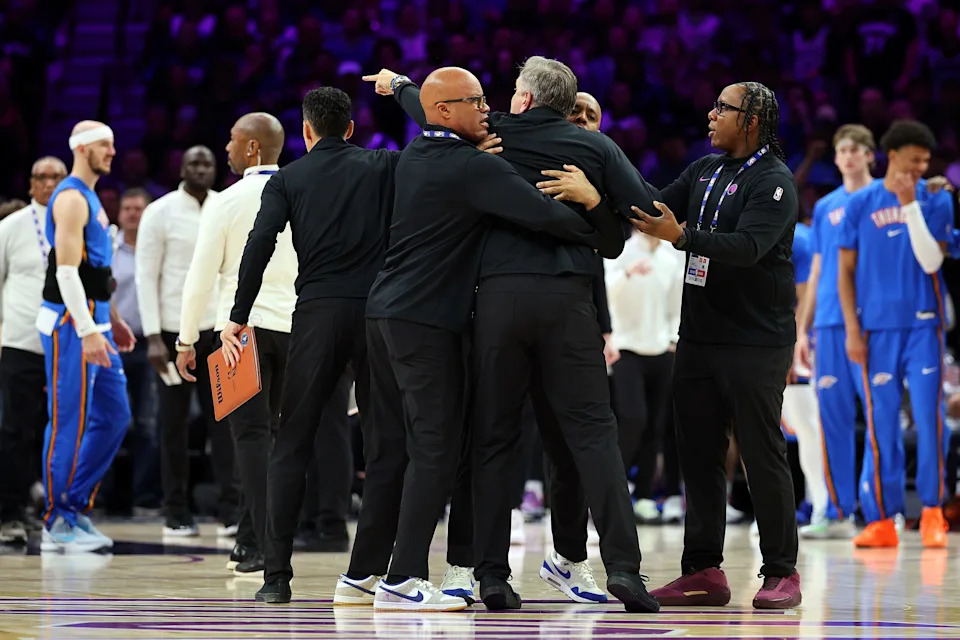 MINNEAPOLIS, MINNESOTA - DECEMBER 19: Head coach Chris Finch of the Minnesota Timberwolves is held back by assistant coaches and security in the first quarter against the Oklahoma City Thunder at Target Center on December 19, 2025 in Minneapolis, Minnesota. Finch was ejected from the game. NOTE TO USER: User expressly acknowledges and agrees that, by downloading and or using this photograph, User is consenting to the terms and conditions of the Getty Images License Agreement. (Photo by David Berding/Getty Images)