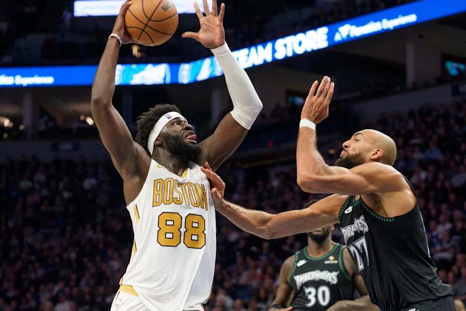 Nov 29, 2025; Minneapolis, Minnesota, USA; Boston Celtics center Neemias Queta (88) drives against Minnesota Timberwolves center Rudy Gobert (27) in the second quarter at Target Center. Mandatory Credit: Matt Blewett-Imagn Images