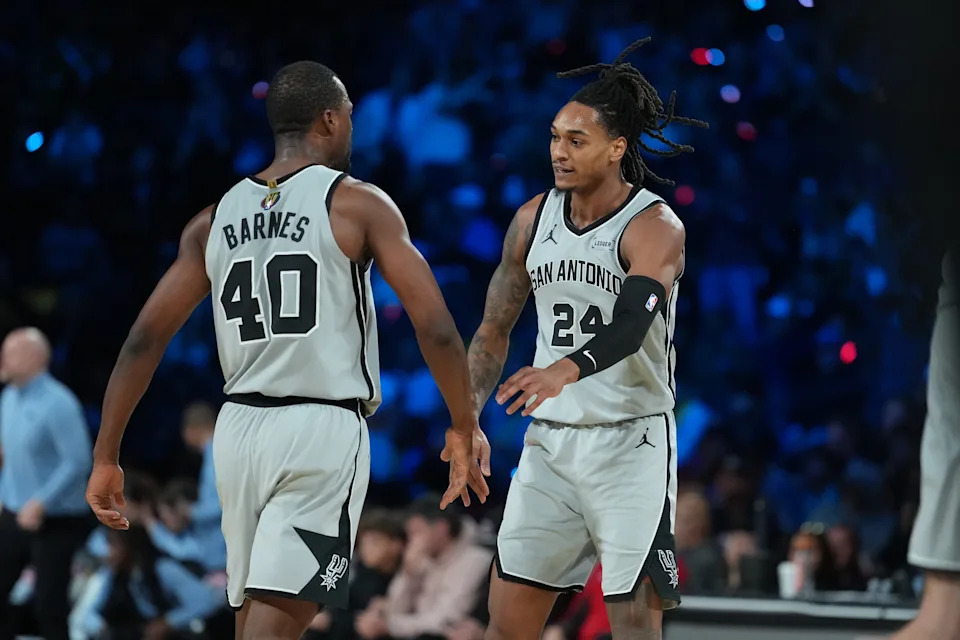 Dec 13, 2025; Las Vegas, Nevada, USA; San Antonio Spurs forward Harrison Barnes (40) and San Antonio Spurs guard Devin Vassell (24) react during the third quarter against the Oklahoma City Thunder at T-Mobile Arena. Mandatory Credit: Kirby Lee-Imagn Images