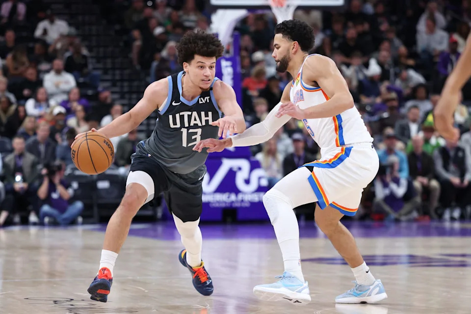 Dec 7, 2025; Salt Lake City, Utah, USA; Utah Jazz guard Walter Clayton Jr. (13) moves the ball as Oklahoma City Thunder guard Ajay Mitchell (25) defends during the second half at Delta Center. Mandatory Credit: Rob Gray-Imagn Images