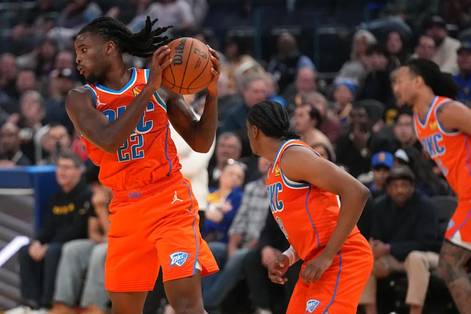 Dec 2, 2025; San Francisco, California, USA; Oklahoma City Thunder guard Cason Wallace (22) holds onto a rebound against the Golden State Warriors in the second quarter at the Chase Center. Mandatory Credit: Cary Edmondson-Imagn Images