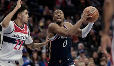 Sixers Tyrese Maxey goes around Wizards # 27 Will Riley in the first half of the Washington Wizards at Philadelphia 76ers NBA game at Xfinity Mobile Arena in Philadelphia on Tuesday, Dec. 2, 2025.