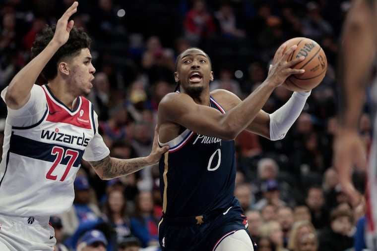 Sixers Tyrese Maxey goes around Wizards # 27 Will Riley in the first half of the Washington Wizards at Philadelphia 76ers NBA game at Xfinity Mobile Arena in Philadelphia on Tuesday, Dec. 2, 2025.