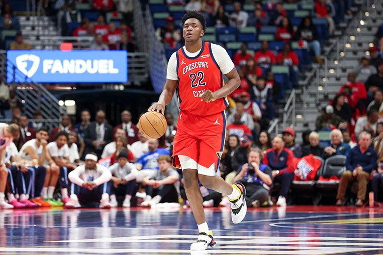 New Orleans Pelicans center Derik Queen (22) brings the ball up the court in the first half of an Emirates NBA Cup basketball game, Wednesday, Nov. 26, 2025, in New Orleans. (AP Photo/Peter Forest)