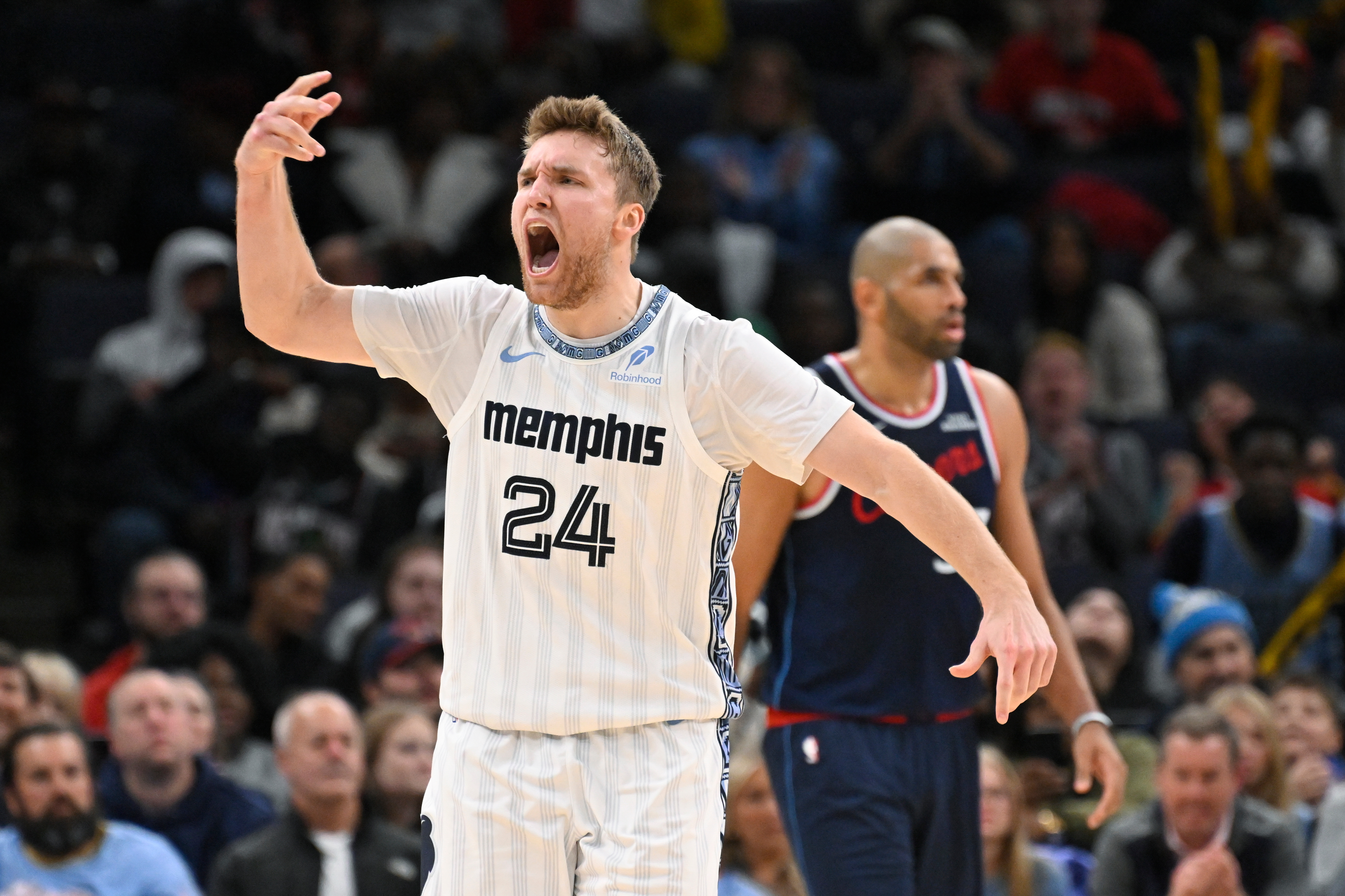 Memphis Grizzlies guard Cam Spencer celebrates after forcing a turnover...