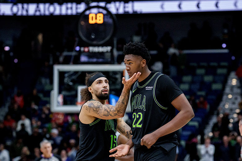 New Orleans Pelicans guard Jose Alvarado (15) tells center Derik Queen (22) to keep his chin up after he missed a last second shot that would have given the Pelicans the lead in the fourth quarter of an NBA basketball game against the San Antonio Spurs in New Orleans, Monday, Dec. 8, 2025. (AP Photo/Matthew Hinton)