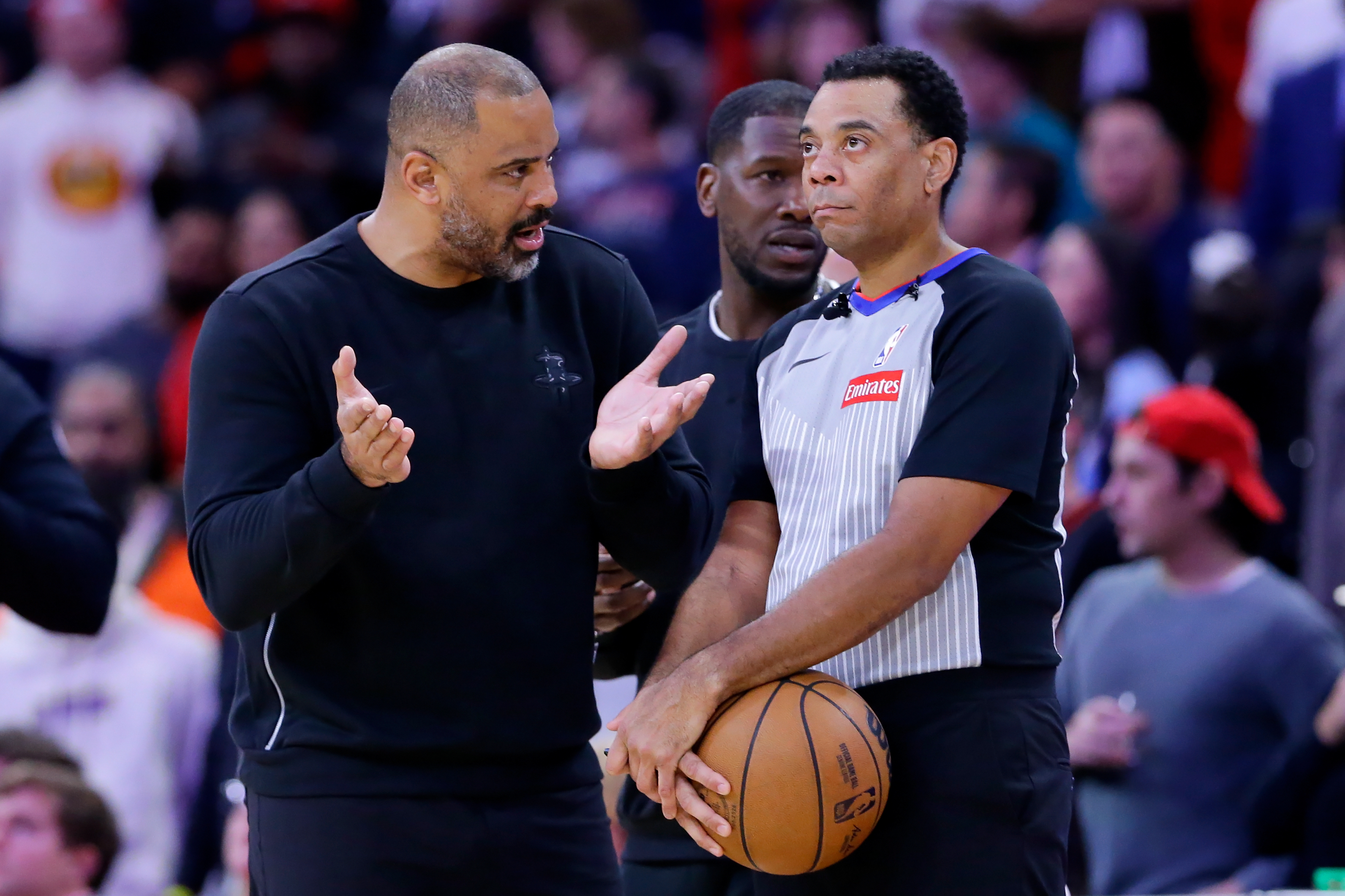 Houston Rockets head coach Ime Udoka, left, appeals to official...
