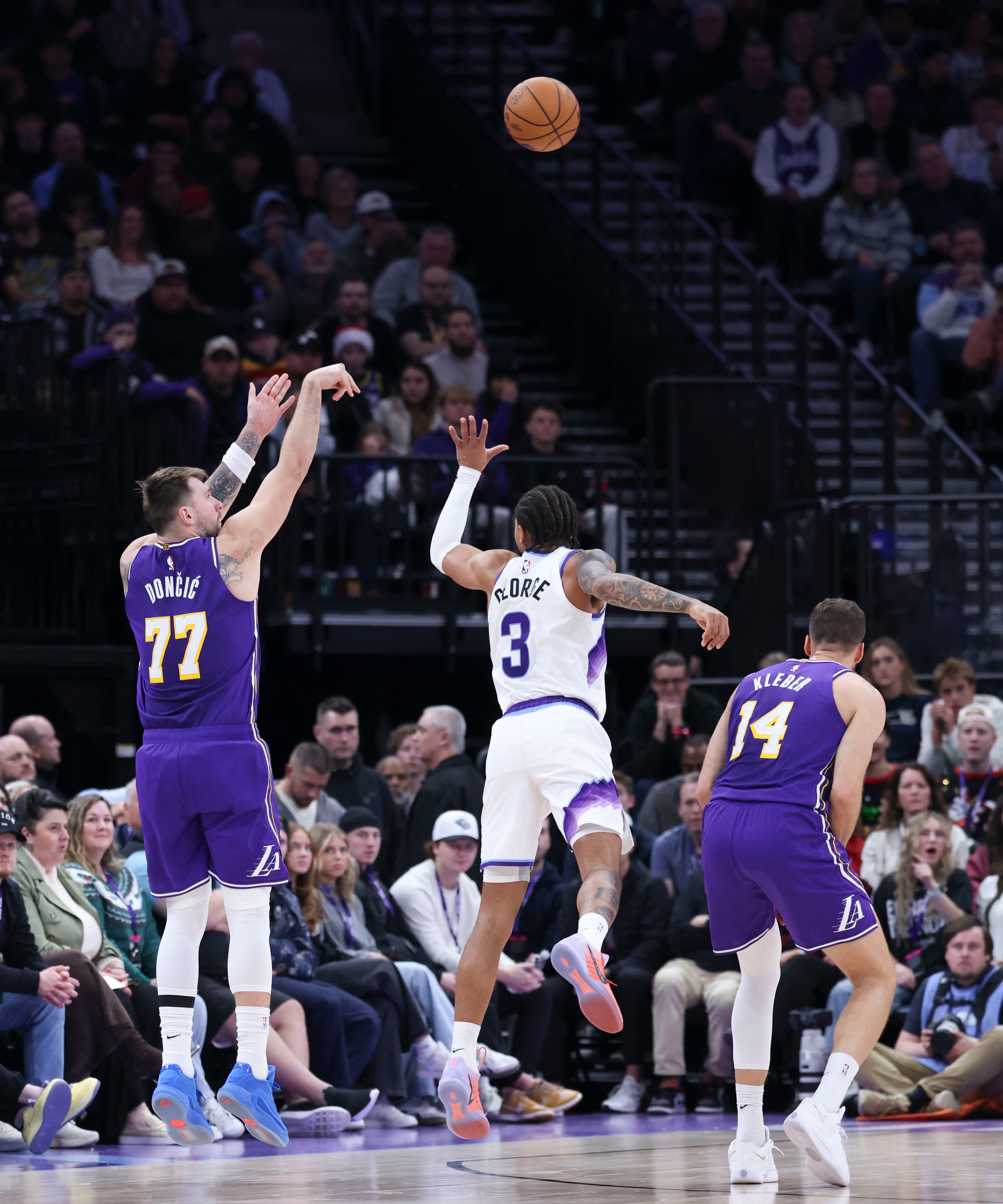 Lakers guard Luka Doncic (77) shoots over Utah Jazz guard...