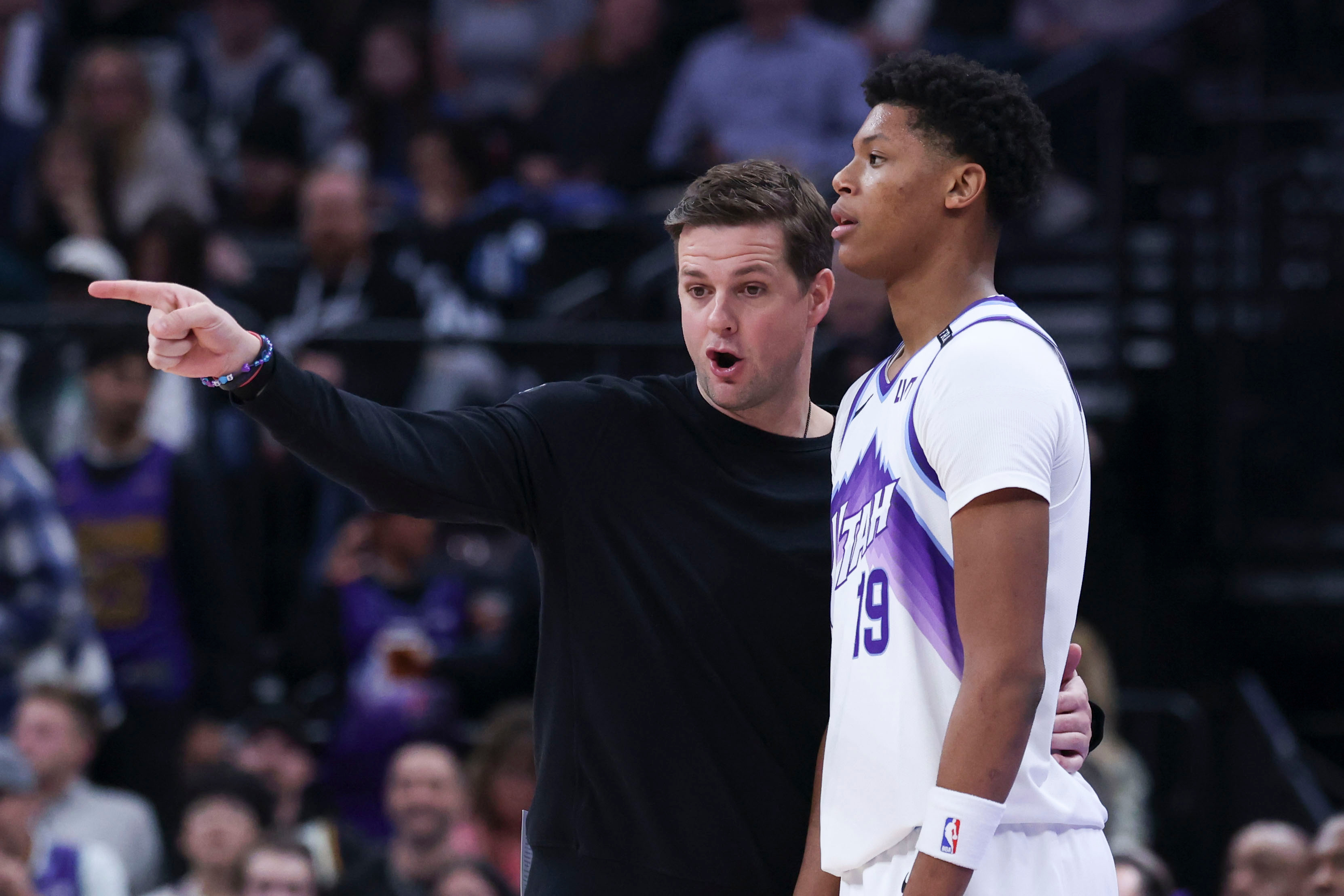 Utah Jazz head coach Will Hardy, left speaks with guard...