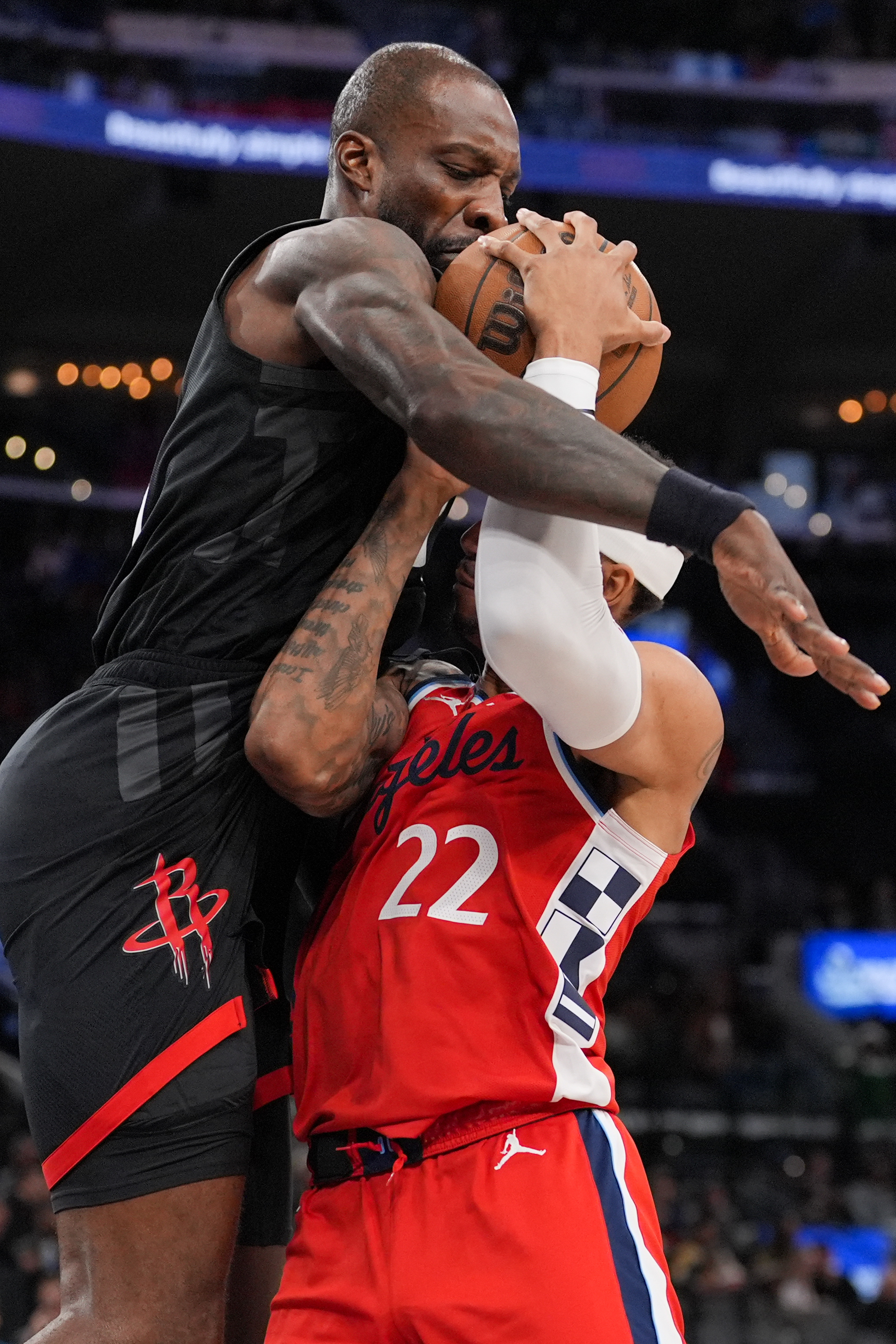 Clippers guard Jordan Miller (22) is fouled by Houston Rockets...