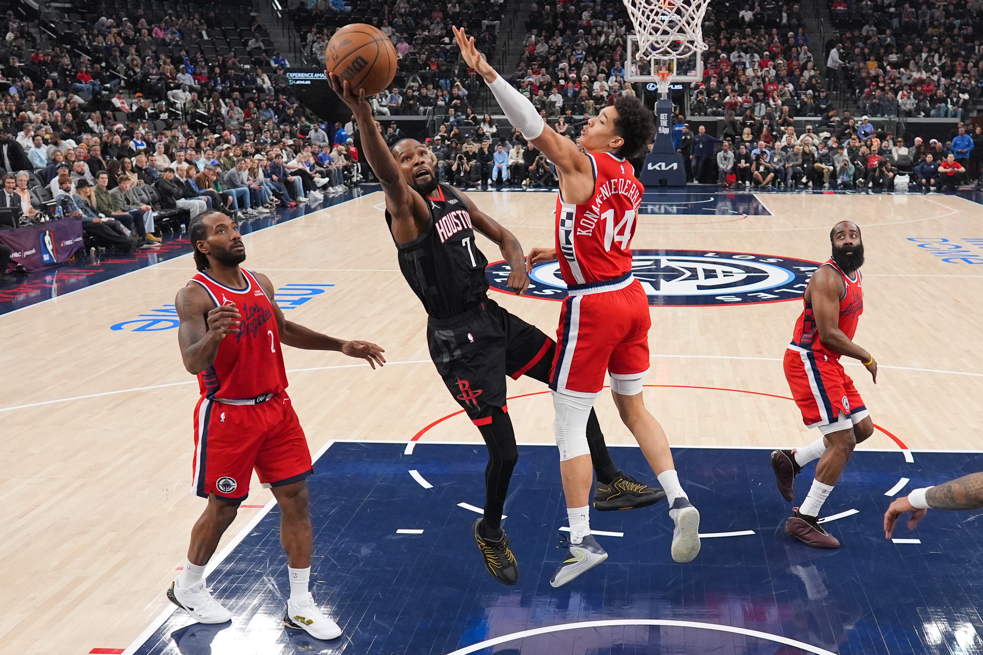 Houston Rockets forward Kevin Durant (7) puts up a shot...