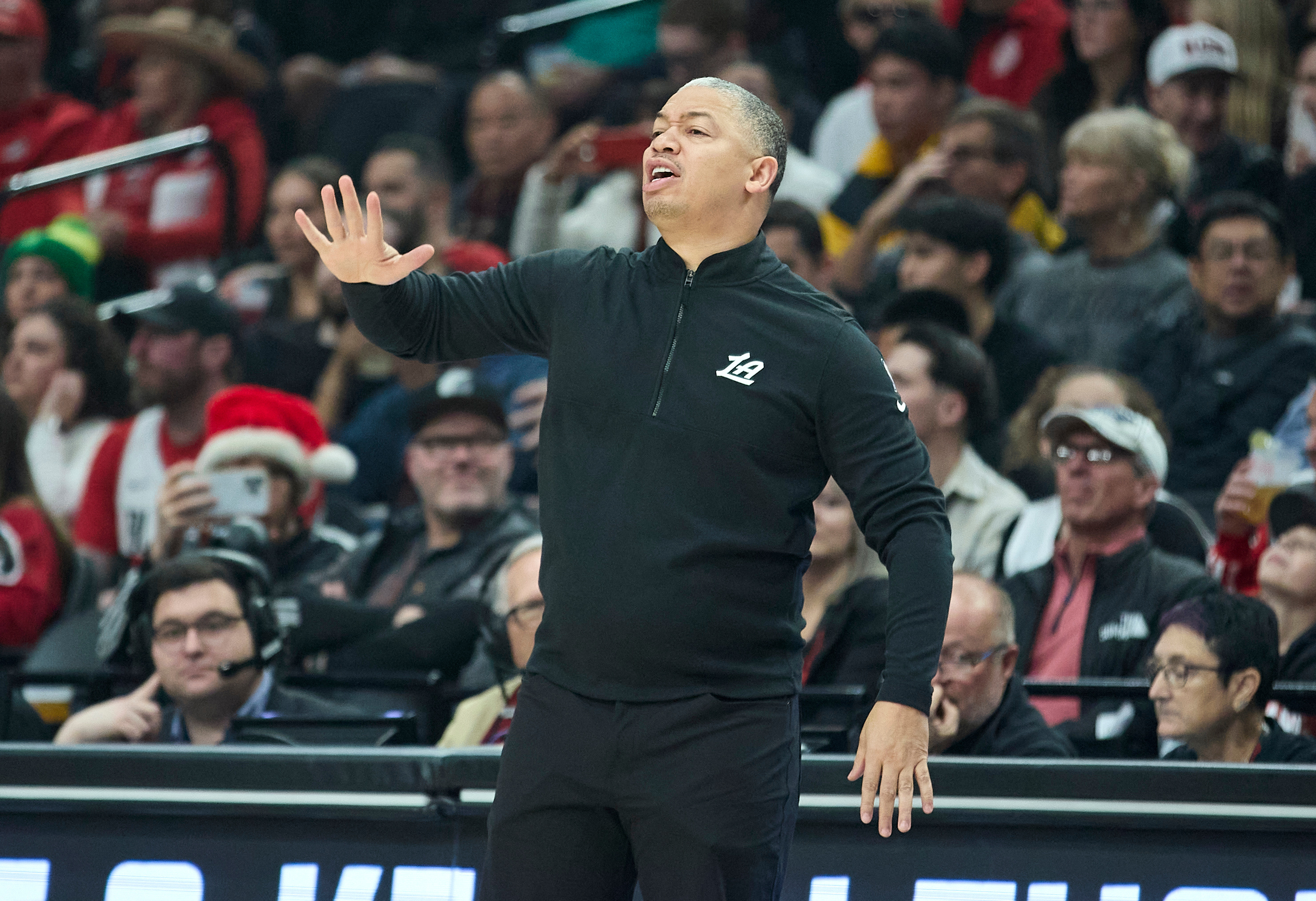 Clippers head coach Tyronn Lue calls a play against the...