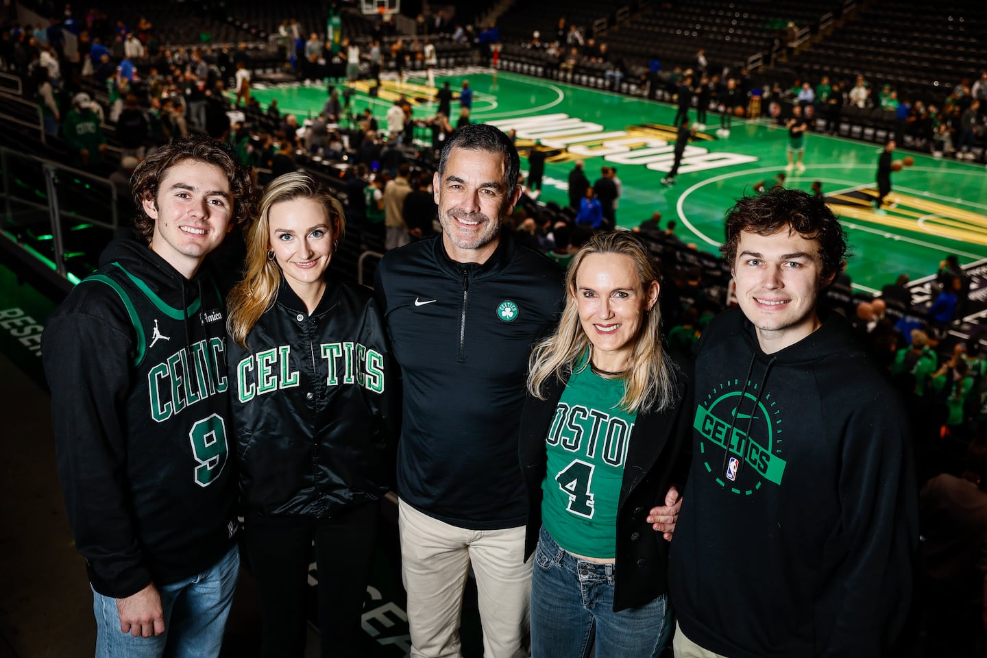 Bill Chisholm (center) and his family at a Celtics game in November. From left: Quentin, Aidan, Chisholm, wife Kimberly, and Will.