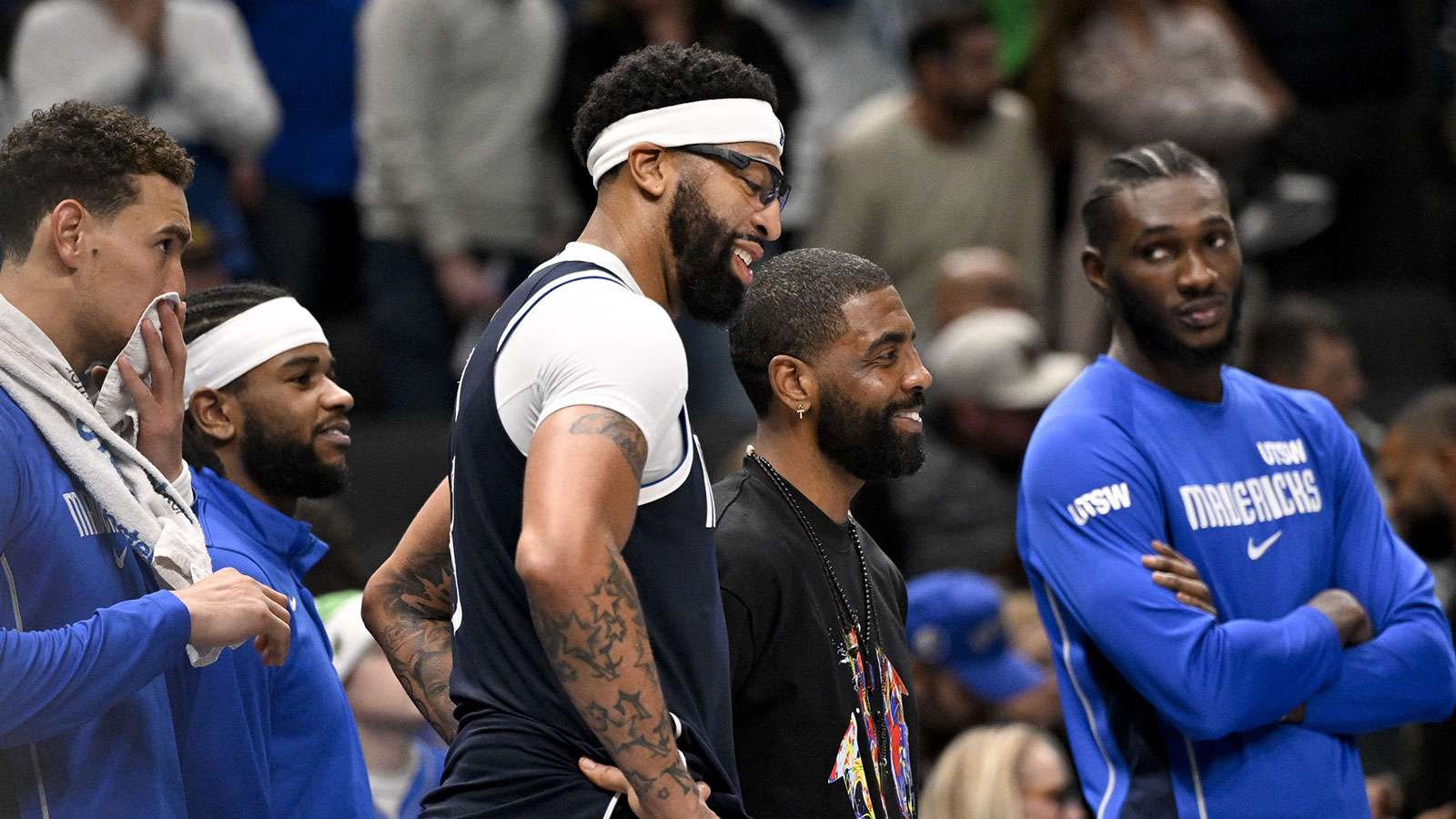 Dallas Mavericks forward Anthony Davis (3) and guard Kyrie Irving (11) look on from the team bench during the game between the Mavericks and the Nets at the American Airlines Center. 