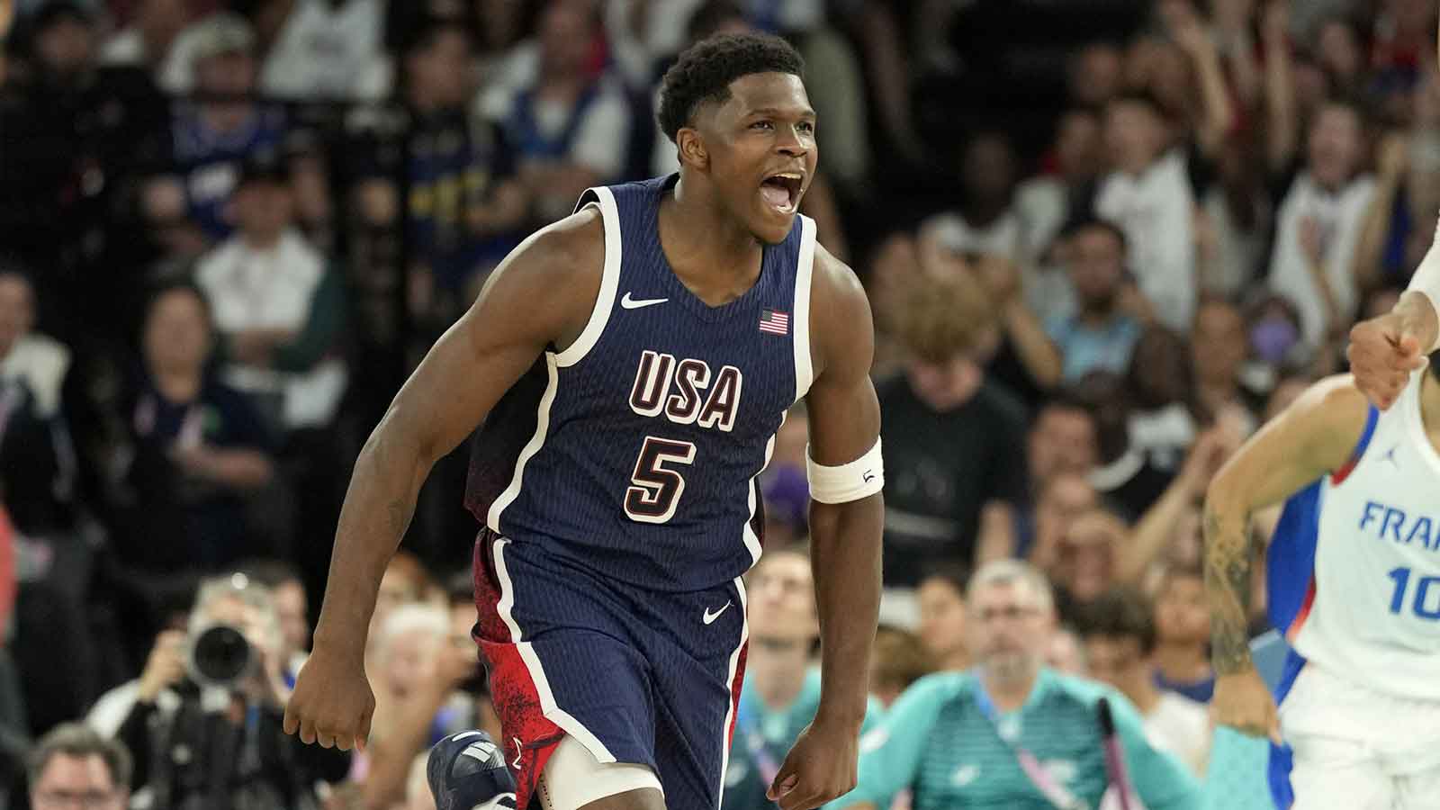 United States guard Anthony Edwards (5) reacts against France in the second half in the men's basketball gold medal game during the Paris 2024 Olympic Summer Games at Accor Arena. 