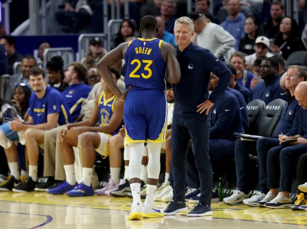 Golden State Warriors' Draymond Green #23 talks with head coach Steve Kerr after fouling out in the fourth quarter of their NBA game against the Memphis Grizzlies at the Chase Center in San Francisco, Calif., on Monday, Oct. 27, 2025. (Jane Tyska/Bay Area News Group)