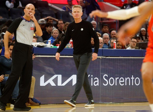 Golden State Warriors head coach Steve Kerr keeps an eye on the game against the Oklahoma City Thunder in the third quarter at the Chase Center in San Francisco, Calif., on Monday, Dec. 2, 2025. (Nhat V. Meyer/Bay Area News Group)