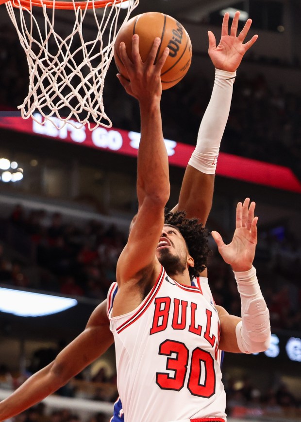Chicago Bulls guard Tre Jones (30) makes a layup in the first quarter during a game against the Philadelphia 76ers, Sunday, Dec. 26, 2025, at the United Center in Chicago. (Dominic Di Palermo/Chicago Tribune)