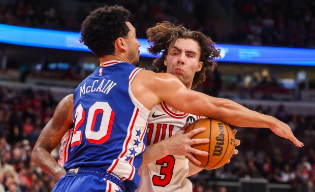 Chicago Bulls guard Josh Giddey (3) and Philadelphia 76ers guard Jared McCain (20) collide in the second quarter, Friday, Dec. 26, 2025, at the United Center in Chicago. (Dominic Di Palermo/Chicago Tribune)