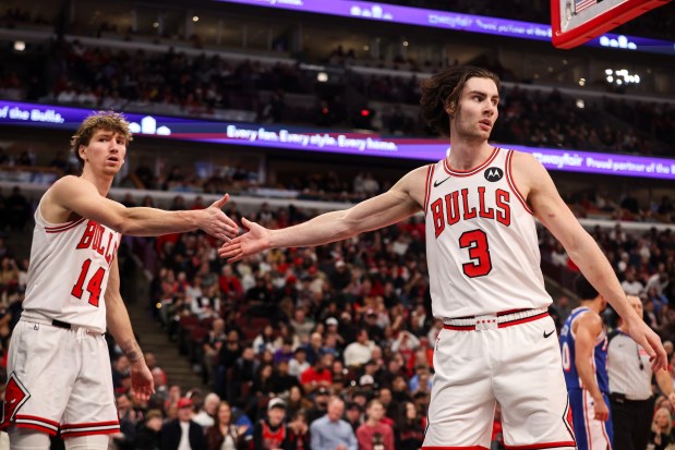 Chicago Bulls forward Matas Buzelis (14) and Chicago Bulls guard Josh Giddey (3) high-five in the second quarter during a game against the Philadelphia 76ers, Sunday, Dec. 26, 2025, at the United Center in Chicago. (Dominic Di Palermo/Chicago Tribune)