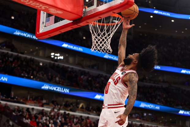 Chicago Bulls guard Coby White (0) makes a layup in the second quarter during a game against the Philadelphia 76ers, Sunday, Dec. 26, 2025, at the United Center in Chicago. (Dominic Di Palermo/Chicago Tribune)