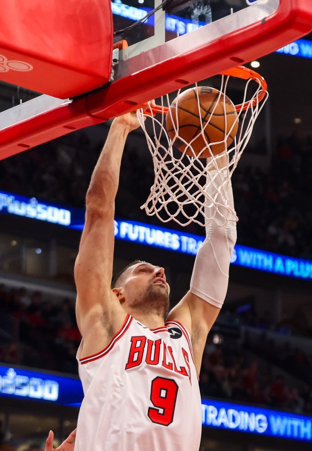 Chicago Bulls center Nikola Vučević (9) dunks the ball in the second quarter during a game against the Philadelphia 76ers, Friday, Dec. 26, 2025, at the United Center in Chicago. (Dominic Di Palermo/Chicago Tribune)