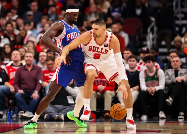Bulls center Nikola Vučević (9) drives the lane against 76ers forward Adem Bona in the fourth quarter Friday, Dec. 26, 2025, at the United Center. (Dominic Di Palermo/Chicago Tribune)
