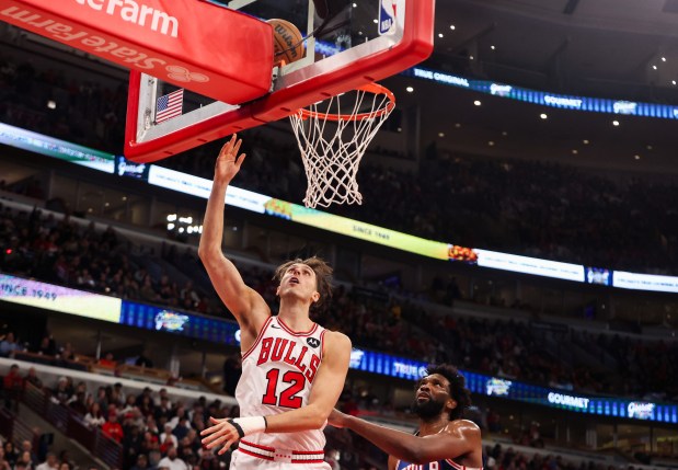 Chicago Bulls center Zach Collins (12) makes a layup in the first quarter during a game against the Philadelphia 76ers, Sunday, Dec. 26, 2025, at the United Center in Chicago. (Dominic Di Palermo/Chicago Tribune)