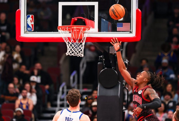 Chicago Bulls guard Ayo Dosunmu (11) makes a layup in the first quarter during a game against the Golden State Warriors, Sunday, Dec. 7, 2025, at the United Center in Chicago. (Dominic Di Palermo/Chicago Tribune)